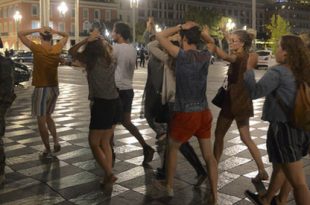 People cross the street with their hands on thier heads as a French soldier secures the area July 15, 2016 after at least 60 people were killed along the Promenade des Anglais in Nice, France, when a truck ran into a crowd celebrating the Bastille Day national holiday July 14.  REUTERS/Jean-Pierre Amet