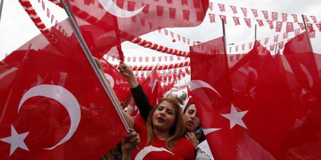 Supporters of Turkish President Tayyip Erdogan wave Turkey's national flags as they wait for the start of a rally for the upcoming referendum in the Kurdish-dominated southeastern city of Diyarbakir, Turkey, April 1, 2017. REUTERS/Murad Sezer